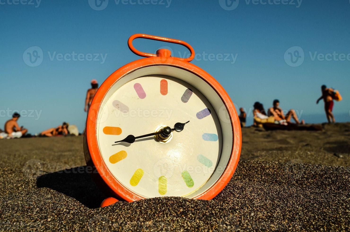 Clock in the sand photo