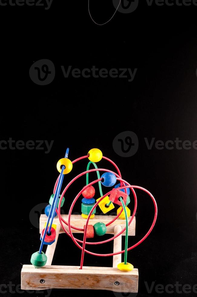 Child's toy on dark background photo