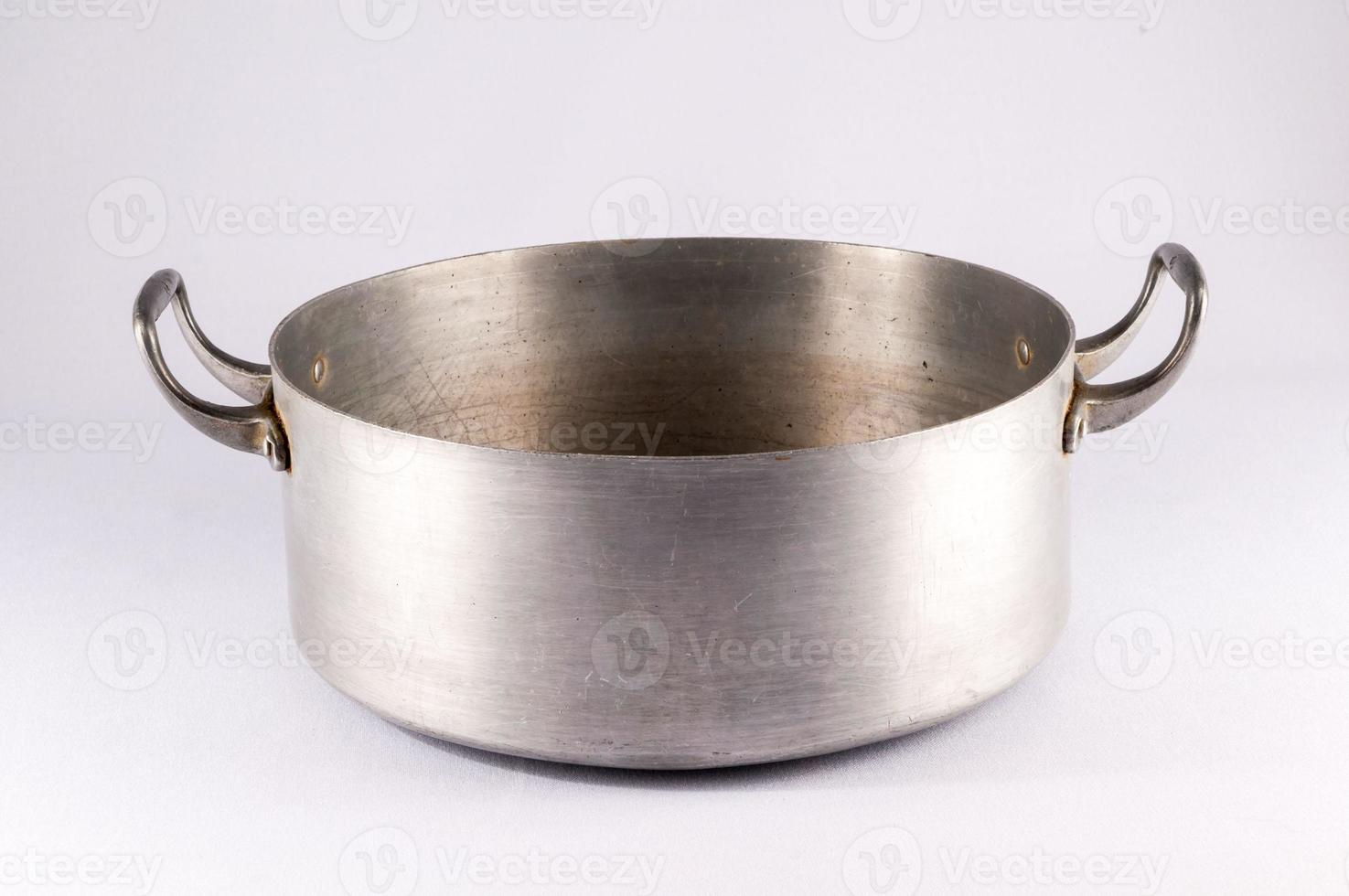 Metal pot on light background photo