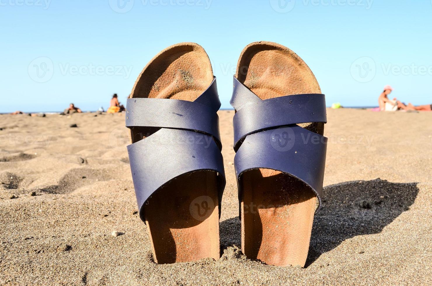 Sandals in the sand photo