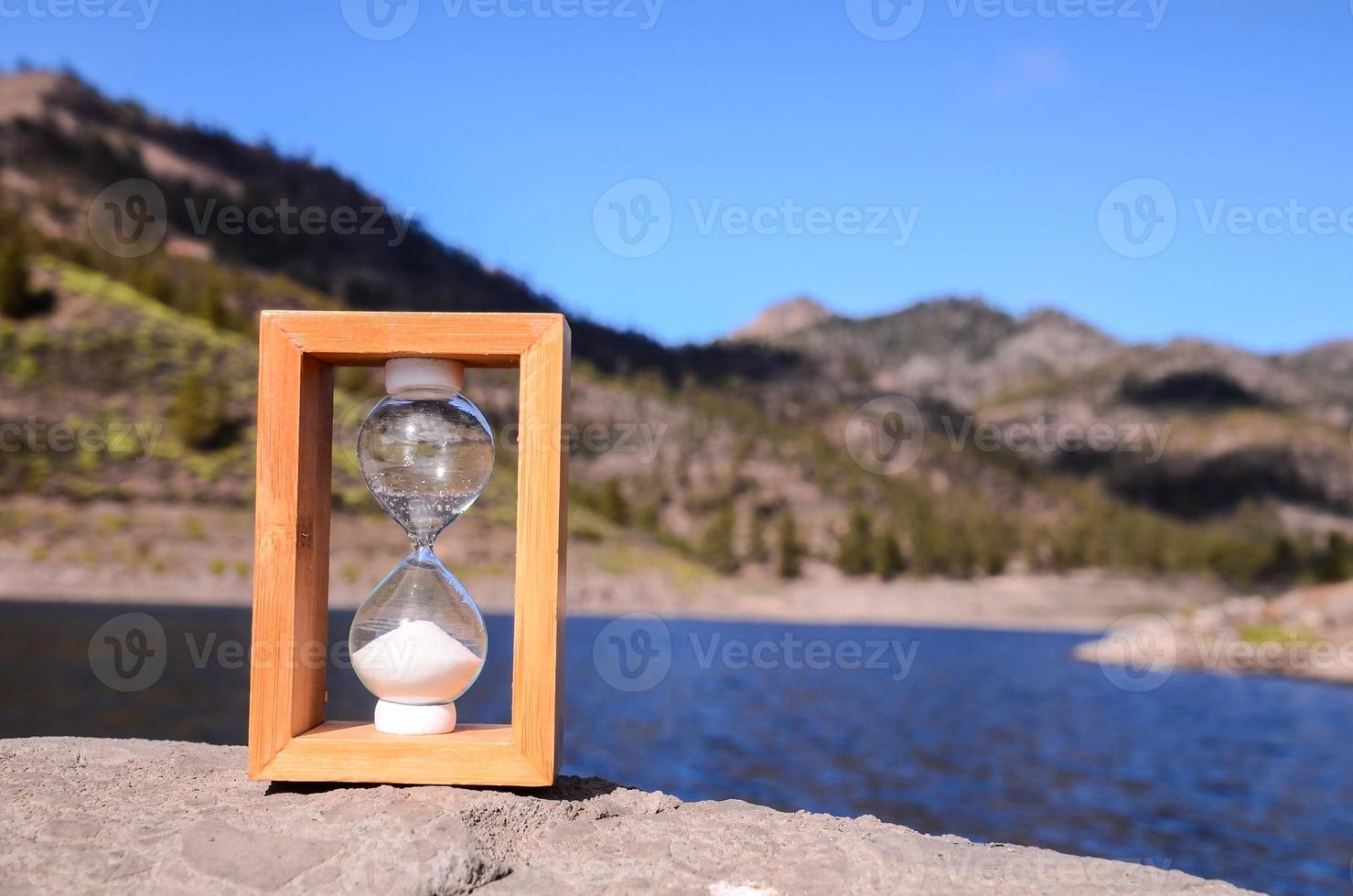 Hourglass on the rocks 21577853 Stock Photo at Vecteezy