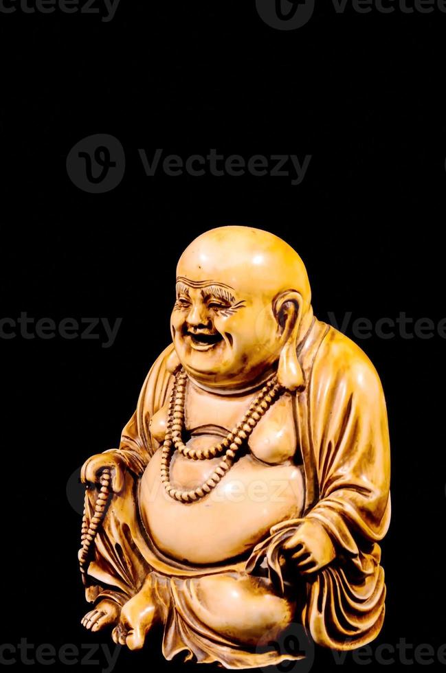 Buddha on dark background photo