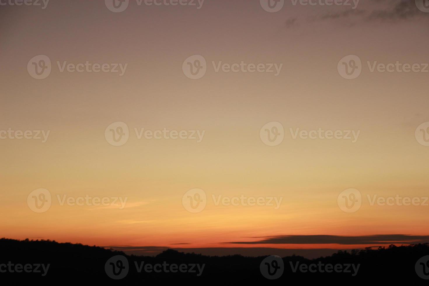 sunrise sunset sky with clouds over the mountain view background photo