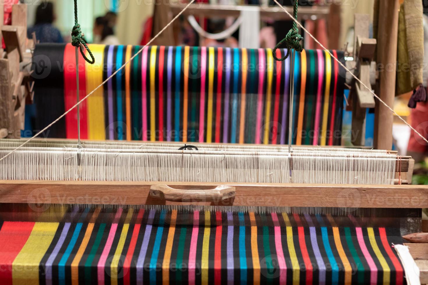 loom that prepared fibers for weaving work in ancient times weaved with natural fibers and is handicraft that is popular with people because weaving from natural fibers takes quite long time to weave. photo