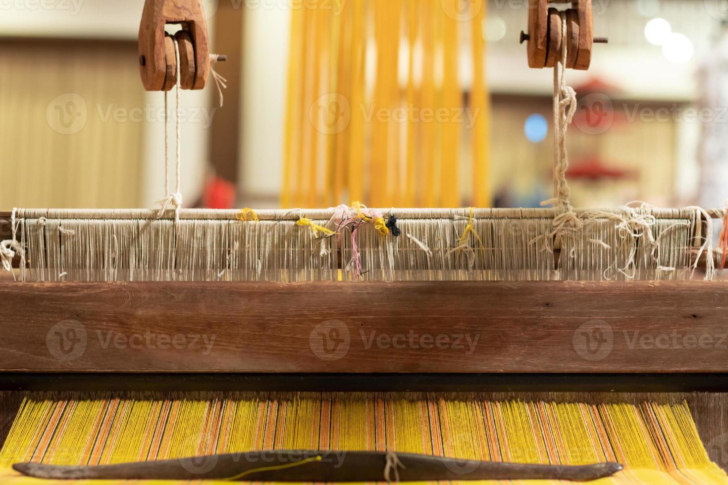 loom that prepared fibers for weaving work in ancient times weaved with natural fibers and is handicraft that is popular with people because weaving from natural fibers takes quite long time to weave. photo