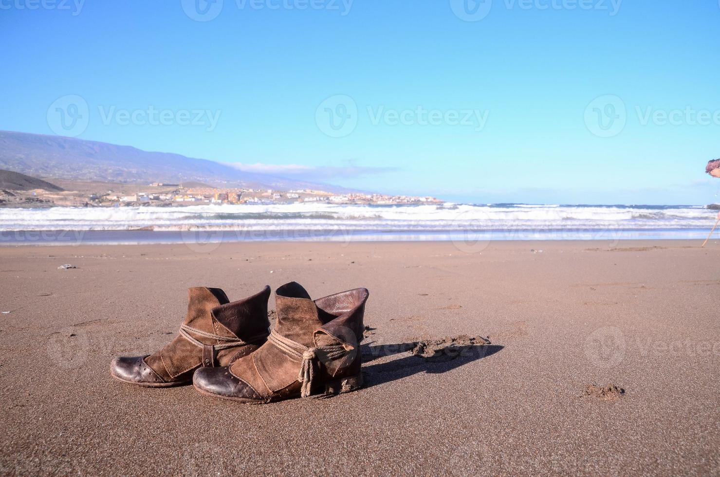 Boots in the sand 21578857 Stock Photo at Vecteezy