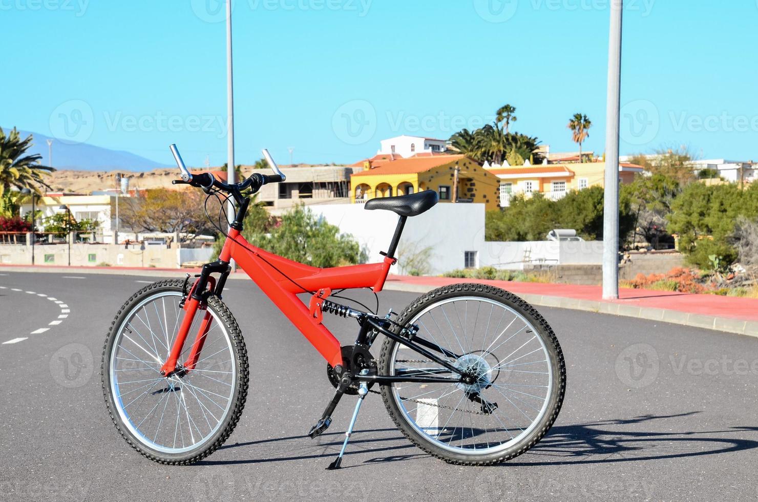 Red bicycle on the road photo