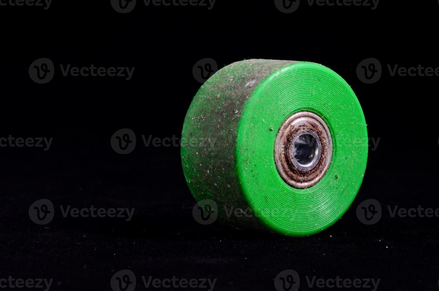 Green wheel on dark background photo