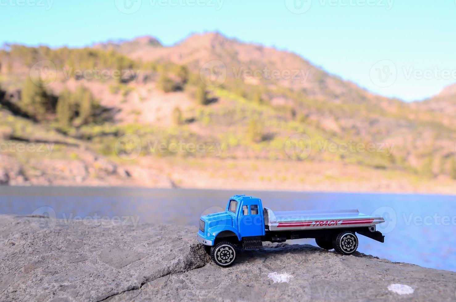 Toy truck on the rock photo
