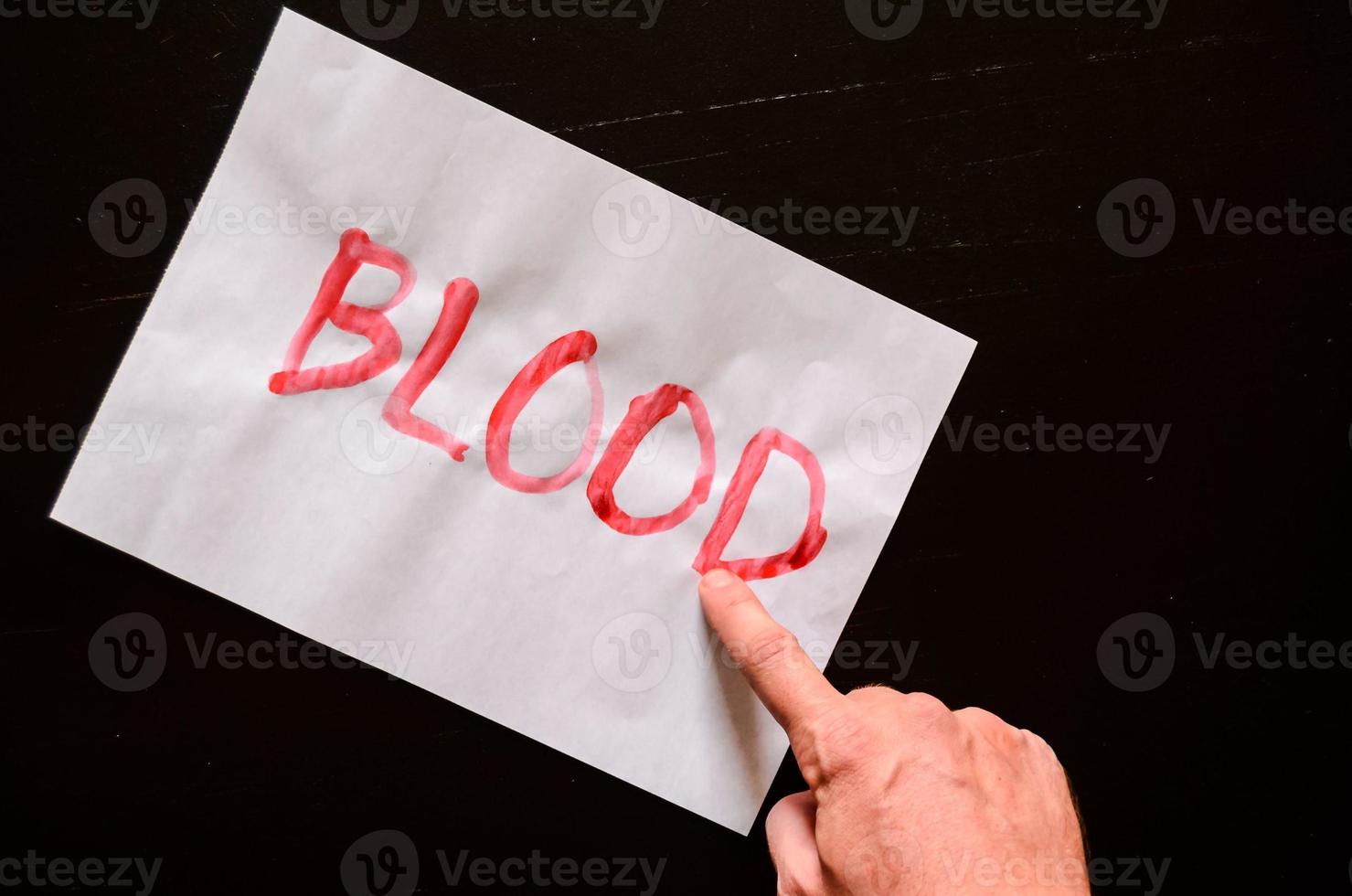 Blood written on paper photo