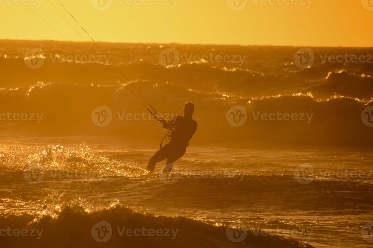 Kitesurfer at sunset photo