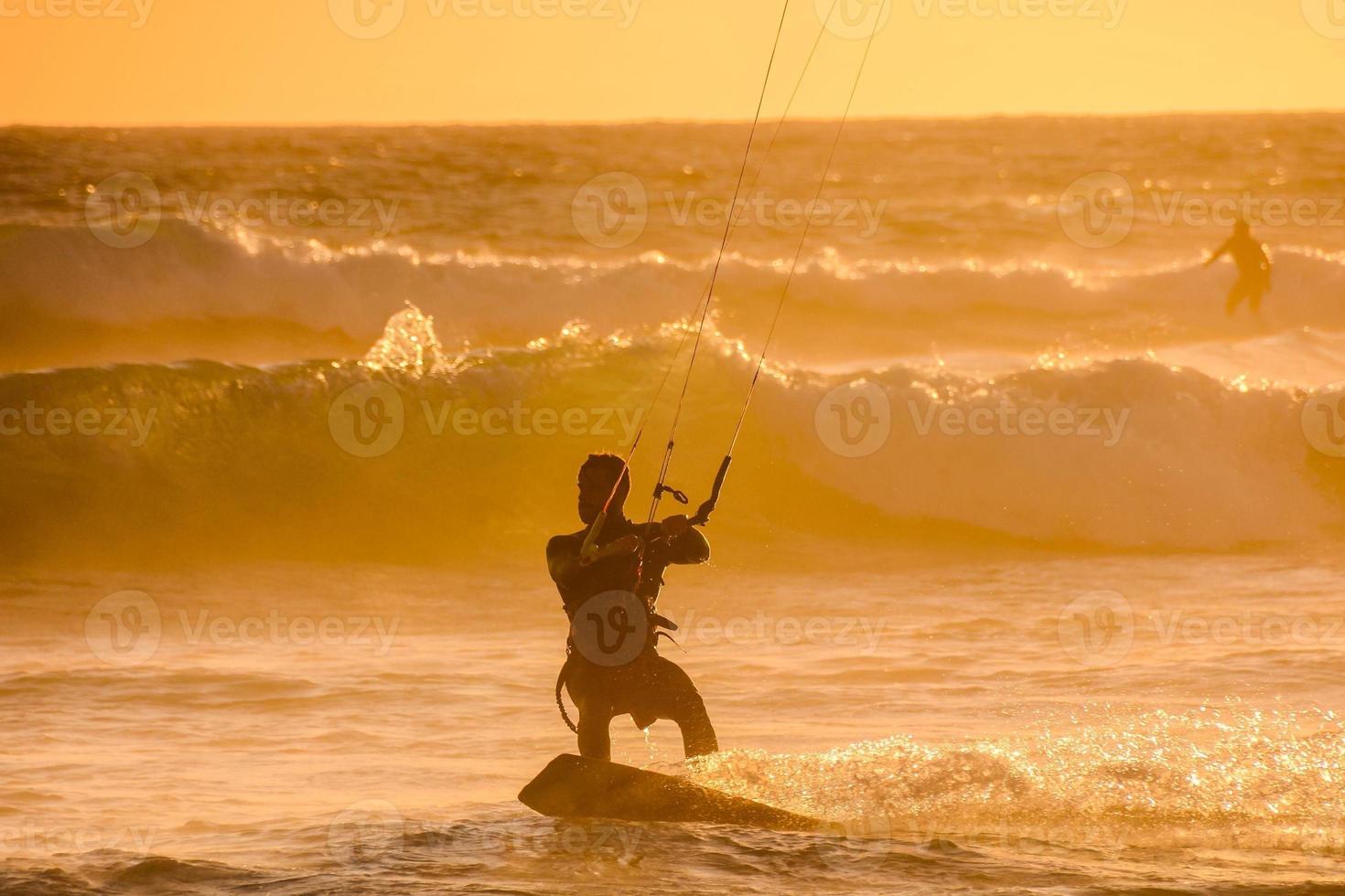 Kitesurfer at sunset photo
