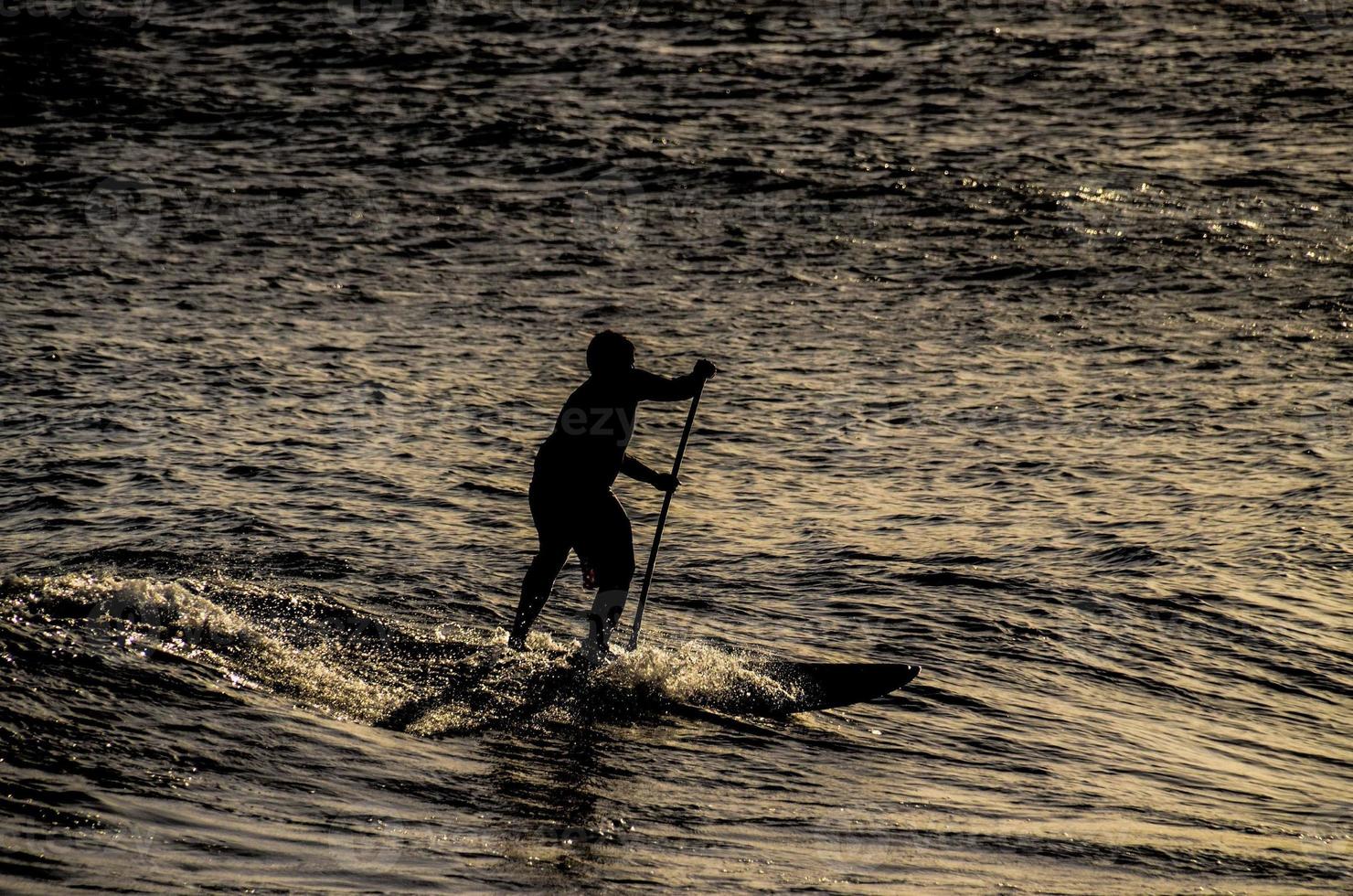 Paddling in the ocean photo