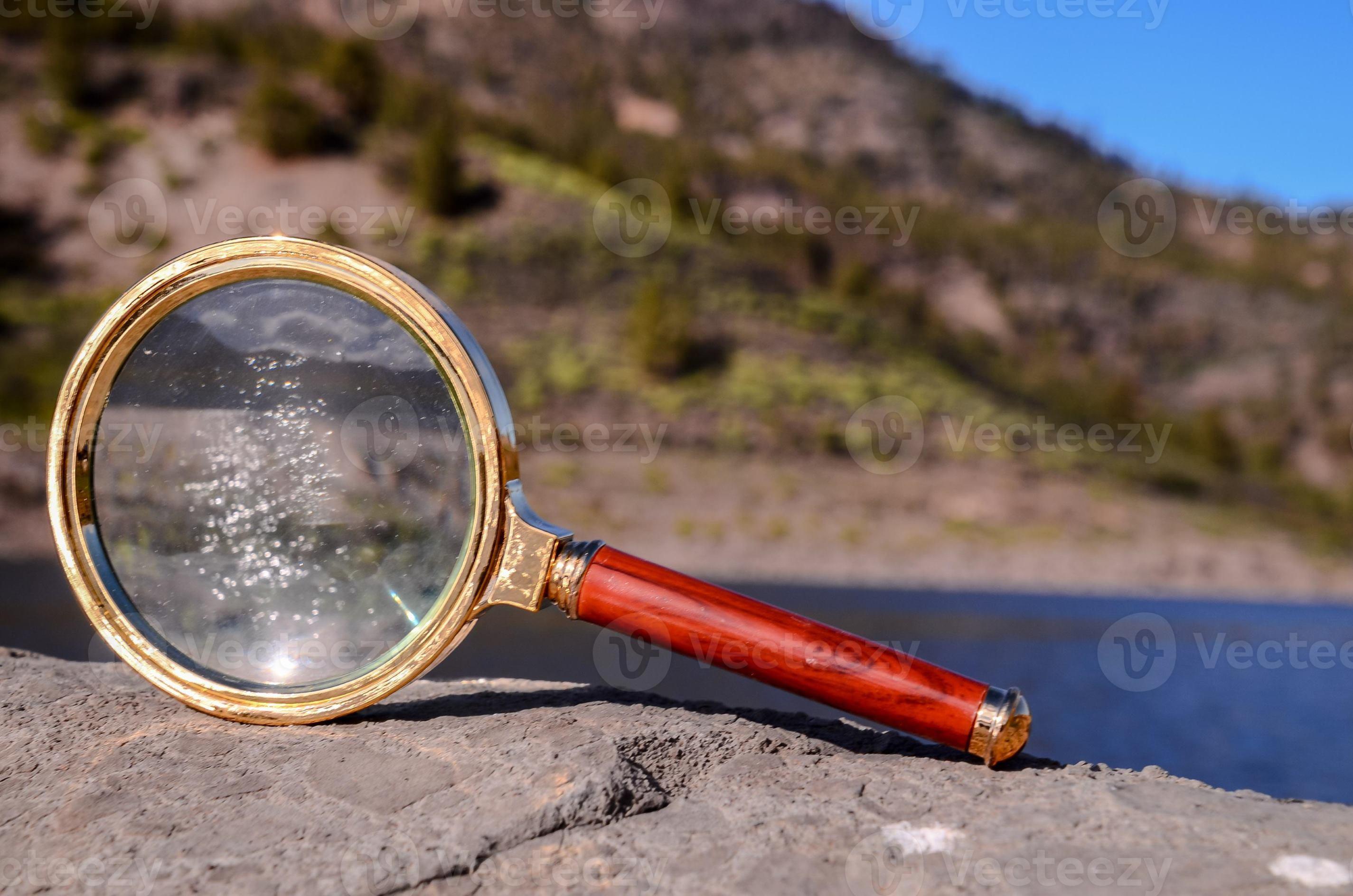 Gold magnifying glass 21584765 Stock Photo at Vecteezy