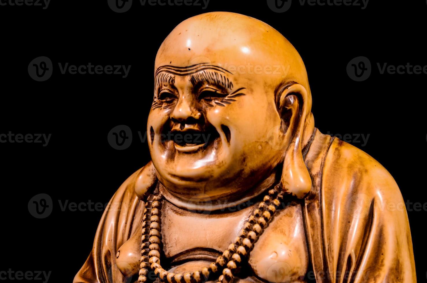 Buddha statue on dark background photo