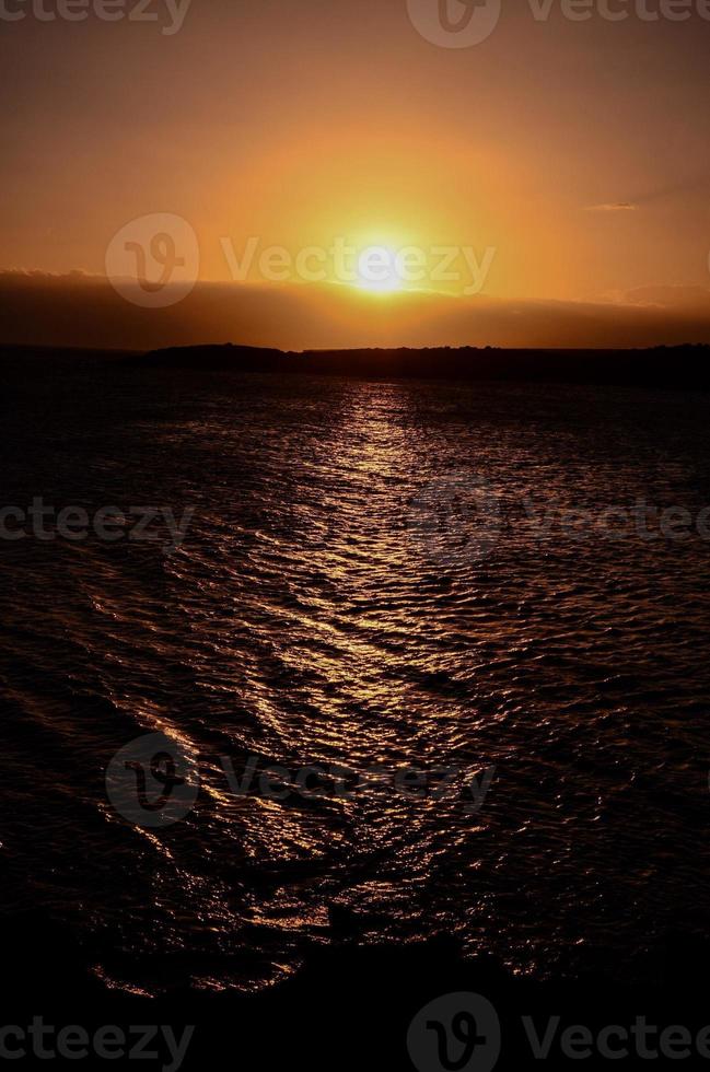 Sunset over the sea photo
