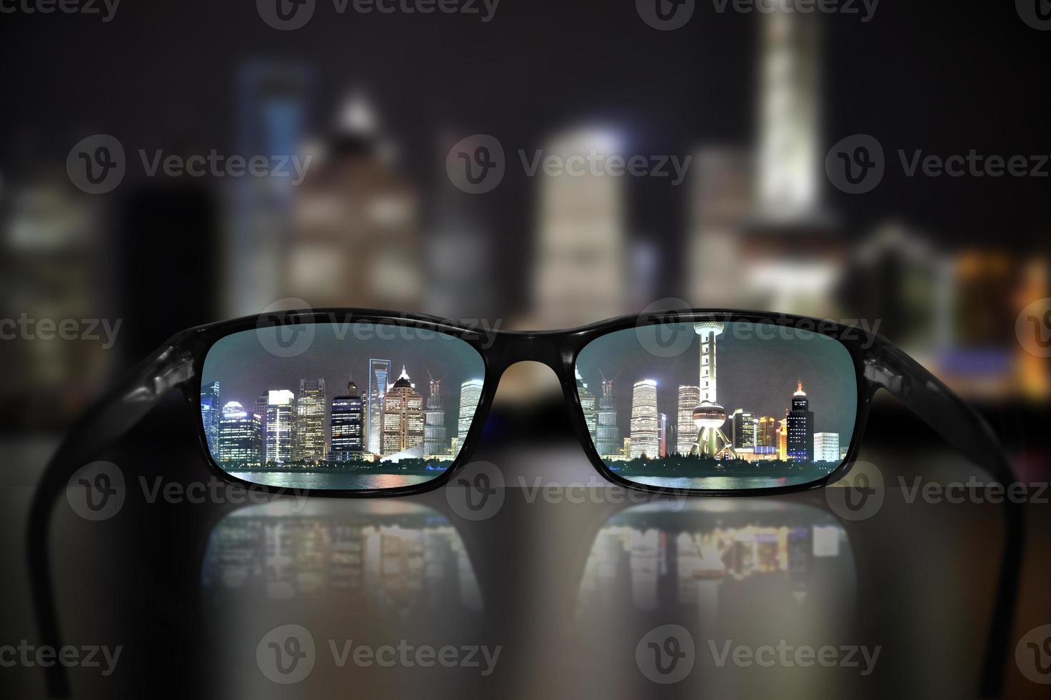 View on Skyscrapers in Shanghai, China At Night Through Glasses - Vision Concept photo