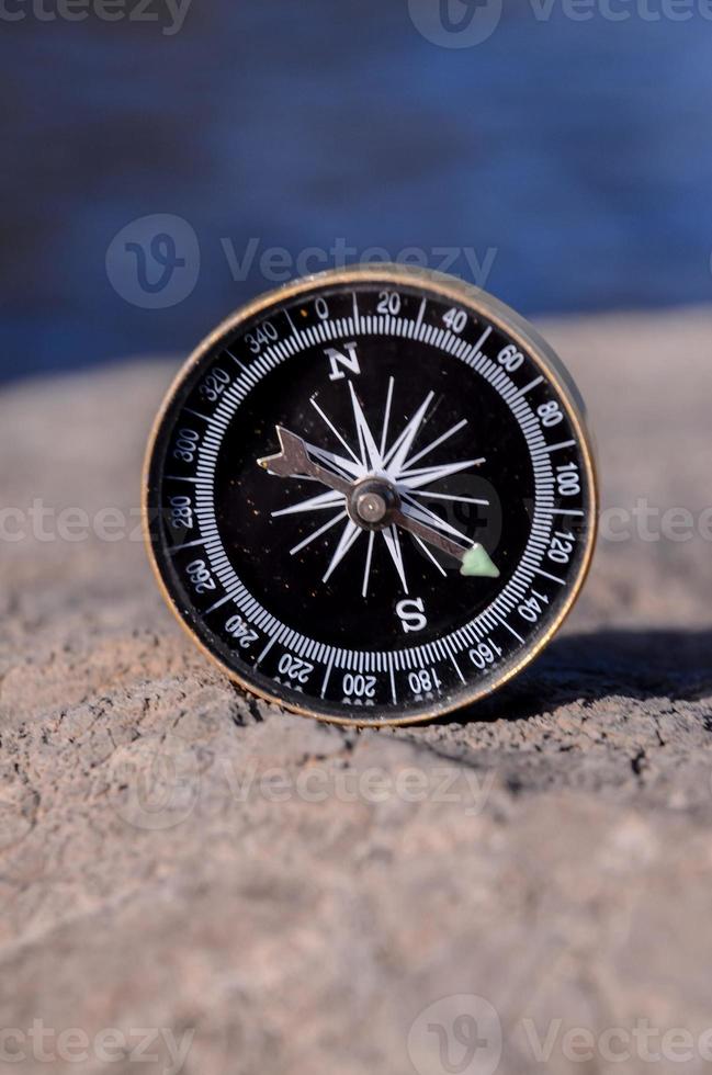 Compass on a rock photo