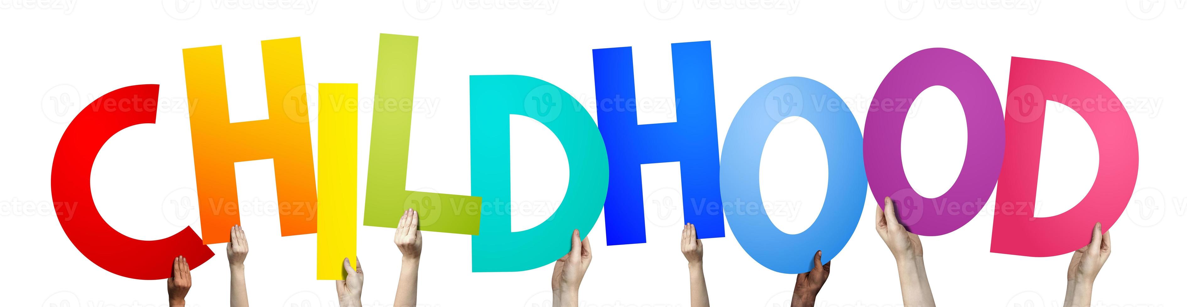 Childhood - Human Hands Holding Colorful Letters photo