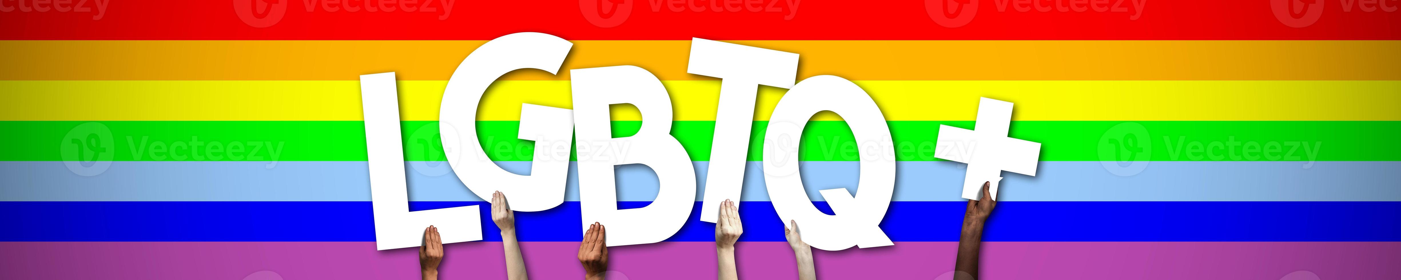 Lgbtq Banner - Human Hands Holding Colorful Letters photo