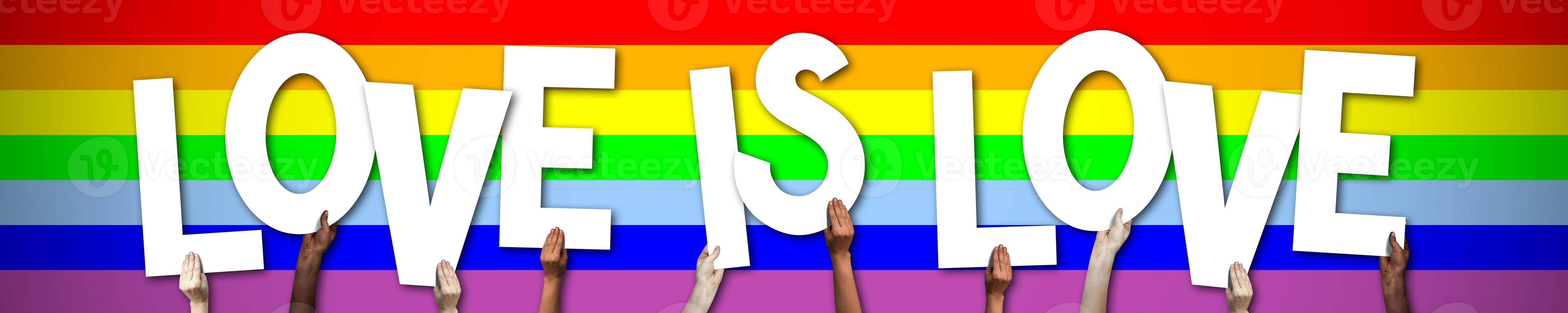 Love is Love, Lgbt Banner - Human Hands Holding Colorful Letters photo