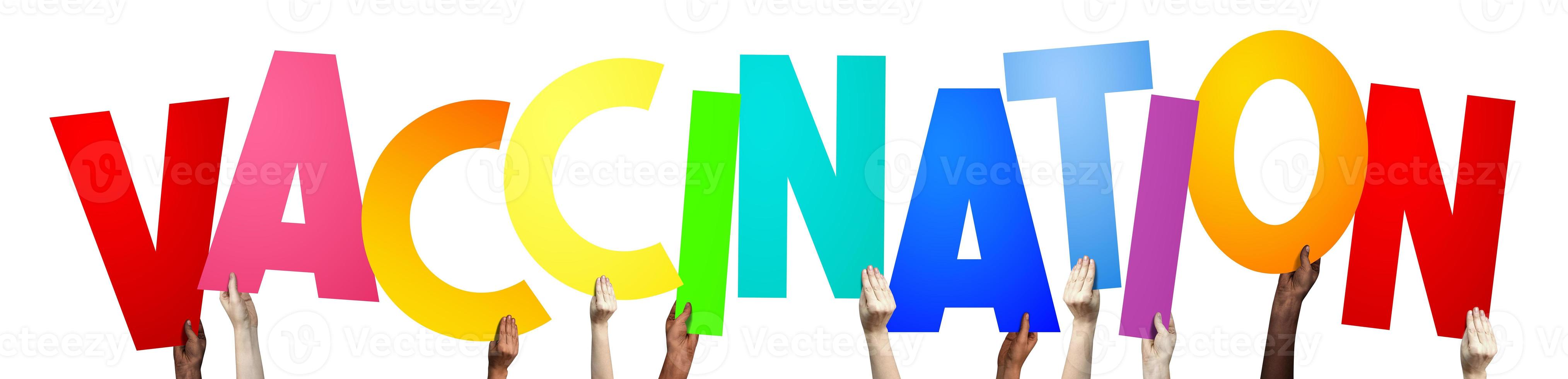 Vaccination - Human Hands Holding Colorful Letters photo