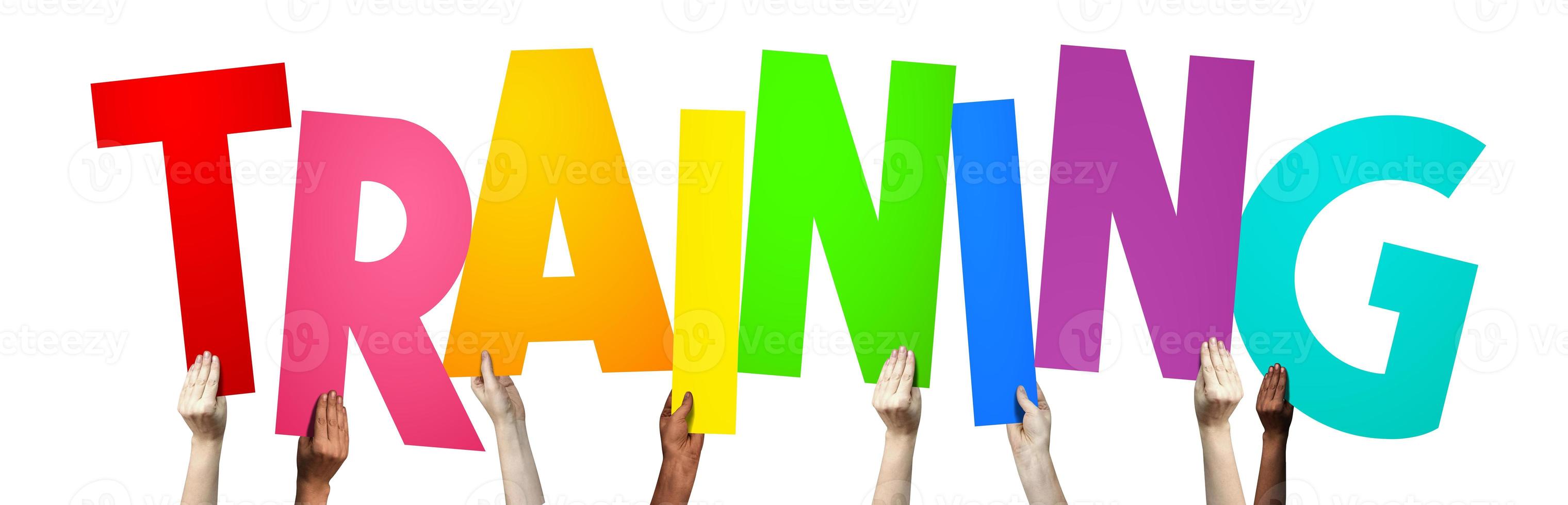 Training - Human Hands Holding Colorful Letters photo