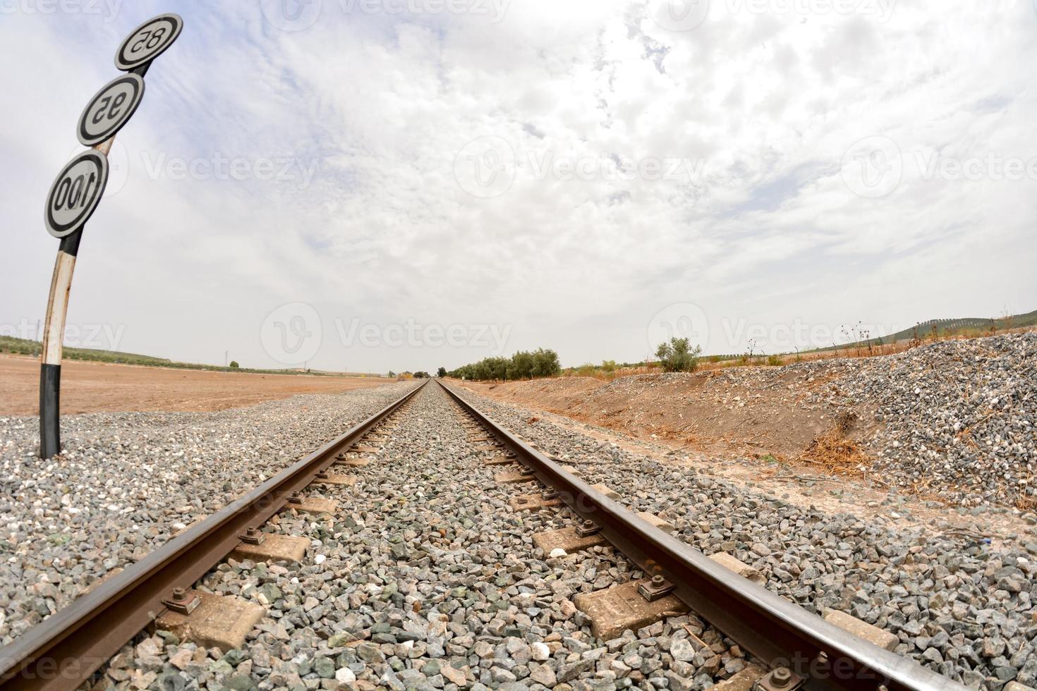 Train tracks over gravel 21588351 Stock Photo at Vecteezy