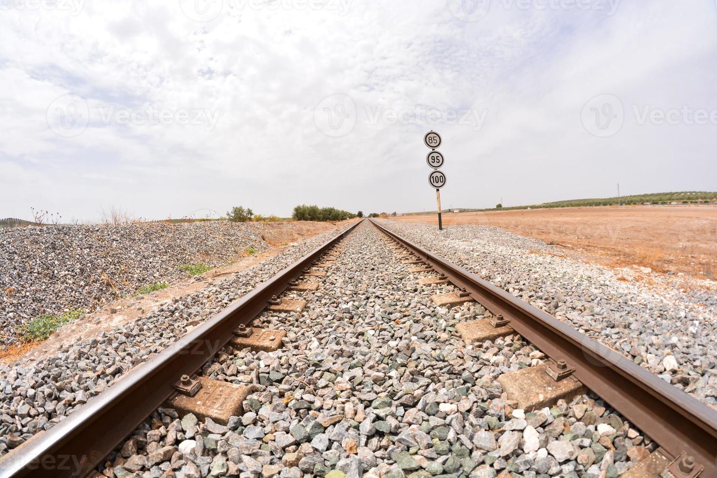 Train tracks over gravel photo