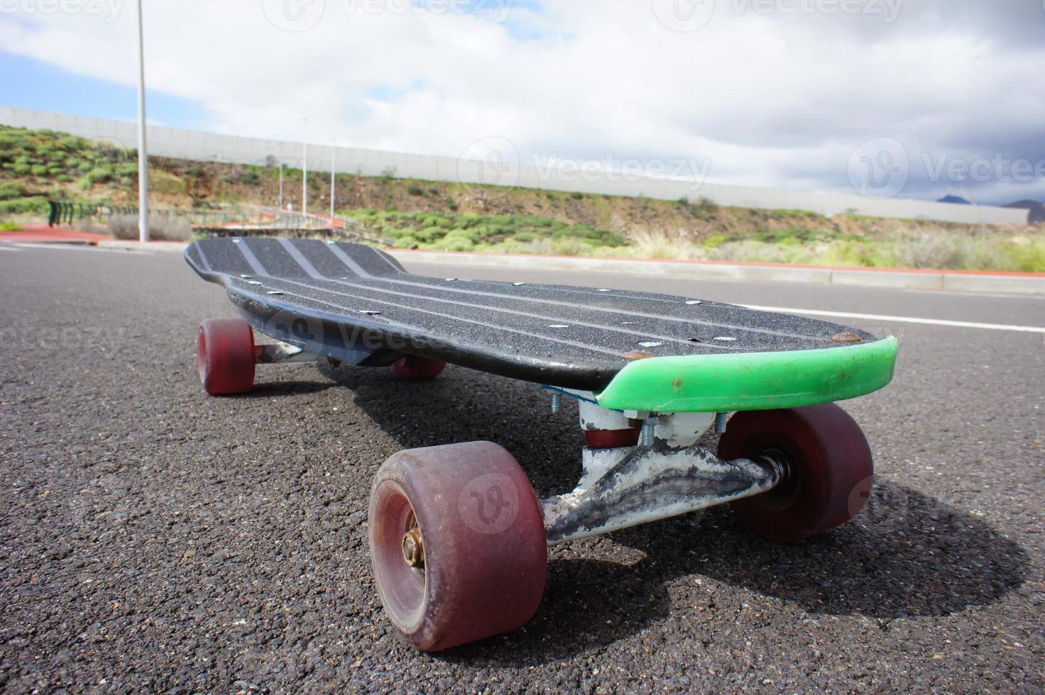 Skateboard on the sidewalk photo