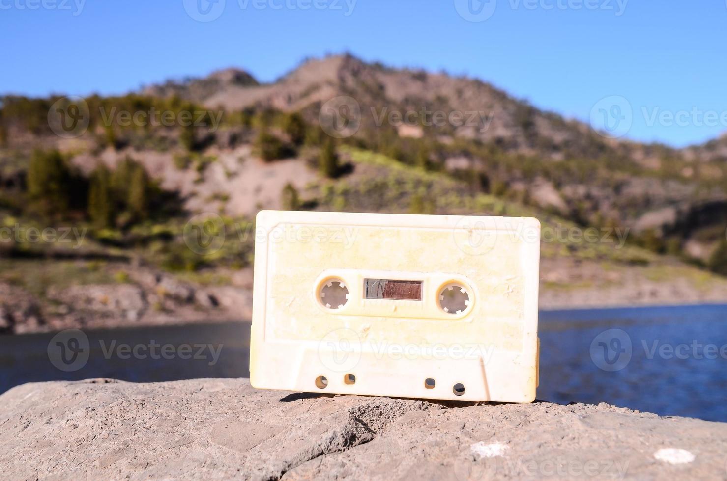 Old cassette tape on a rock photo