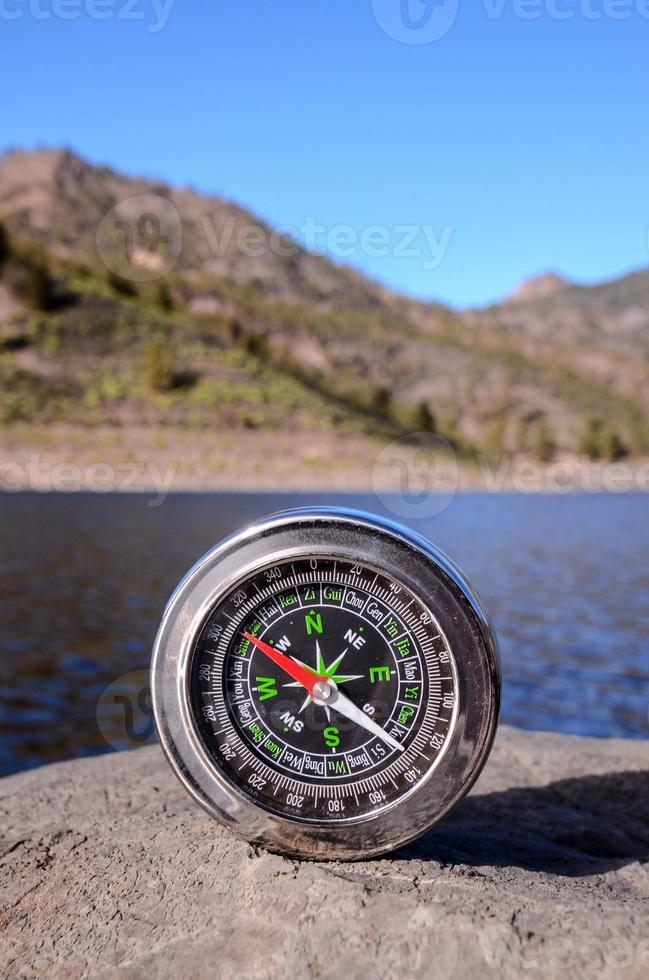 Compass on a rock photo