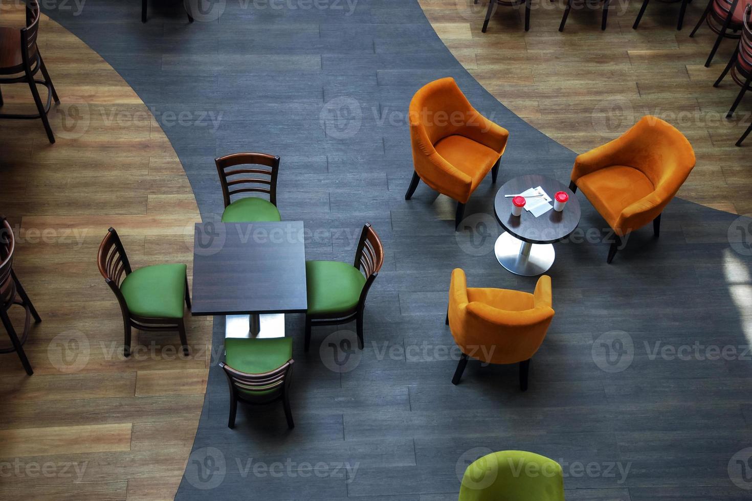 Empty cafe tables and chairs, top view photo