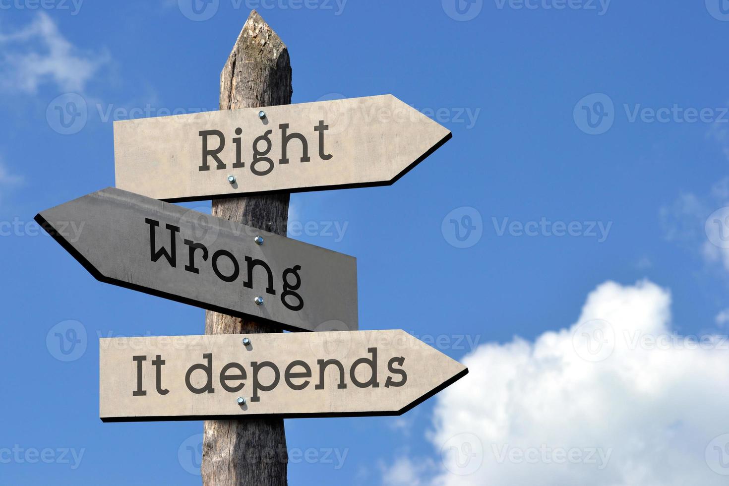 Right, Wrong, it Depends - Wooden Signpost with Three Arrows, Sky with Clouds photo
