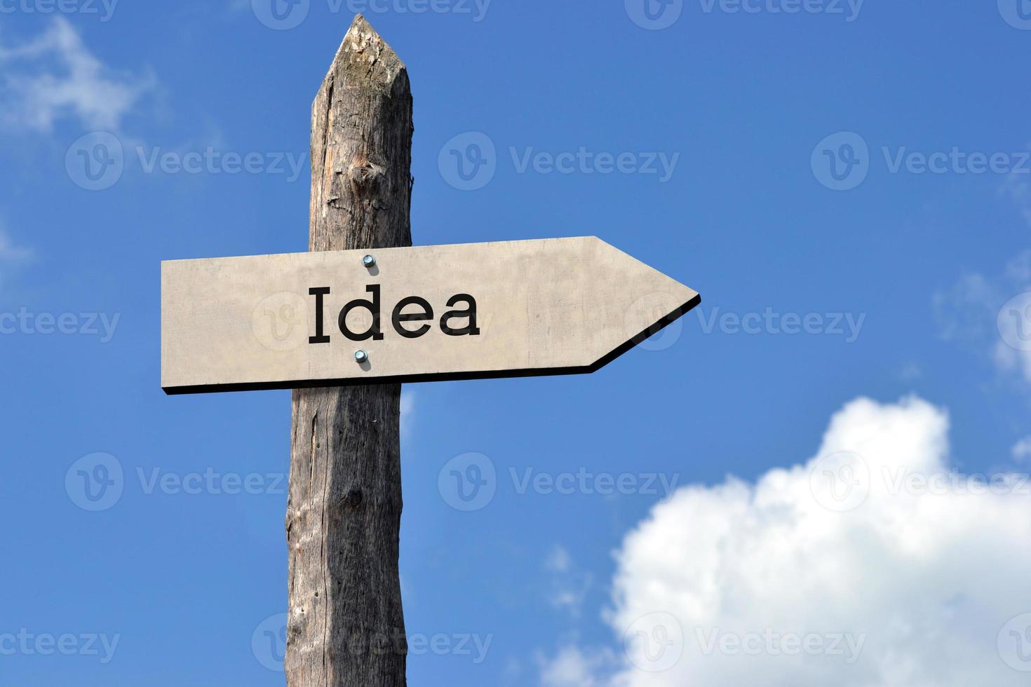 Idea - Wooden Signpost with one Arrow, Sky with Clouds photo