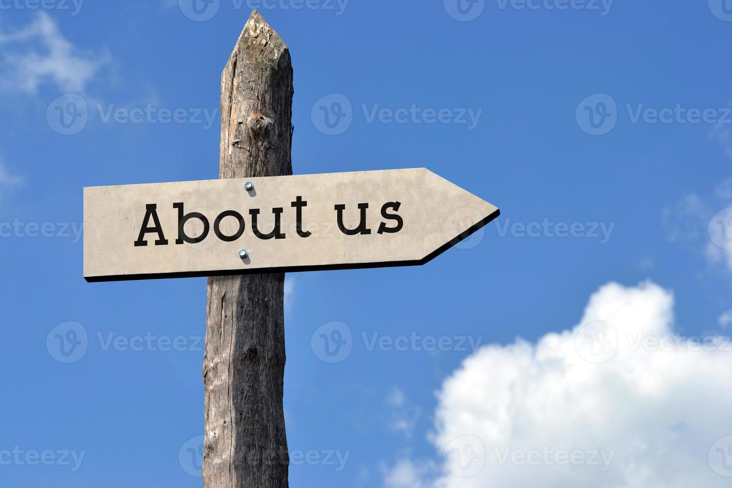 About Us - Wooden Signpost with one Arrow, Sky with Clouds photo