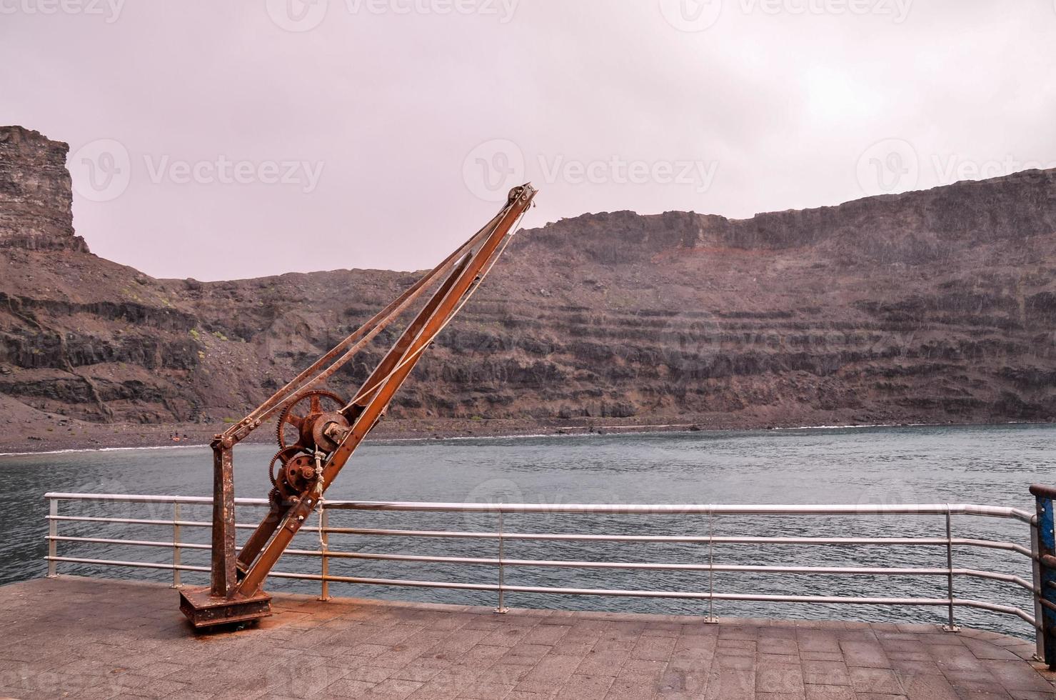 Rusted winch on the coast photo