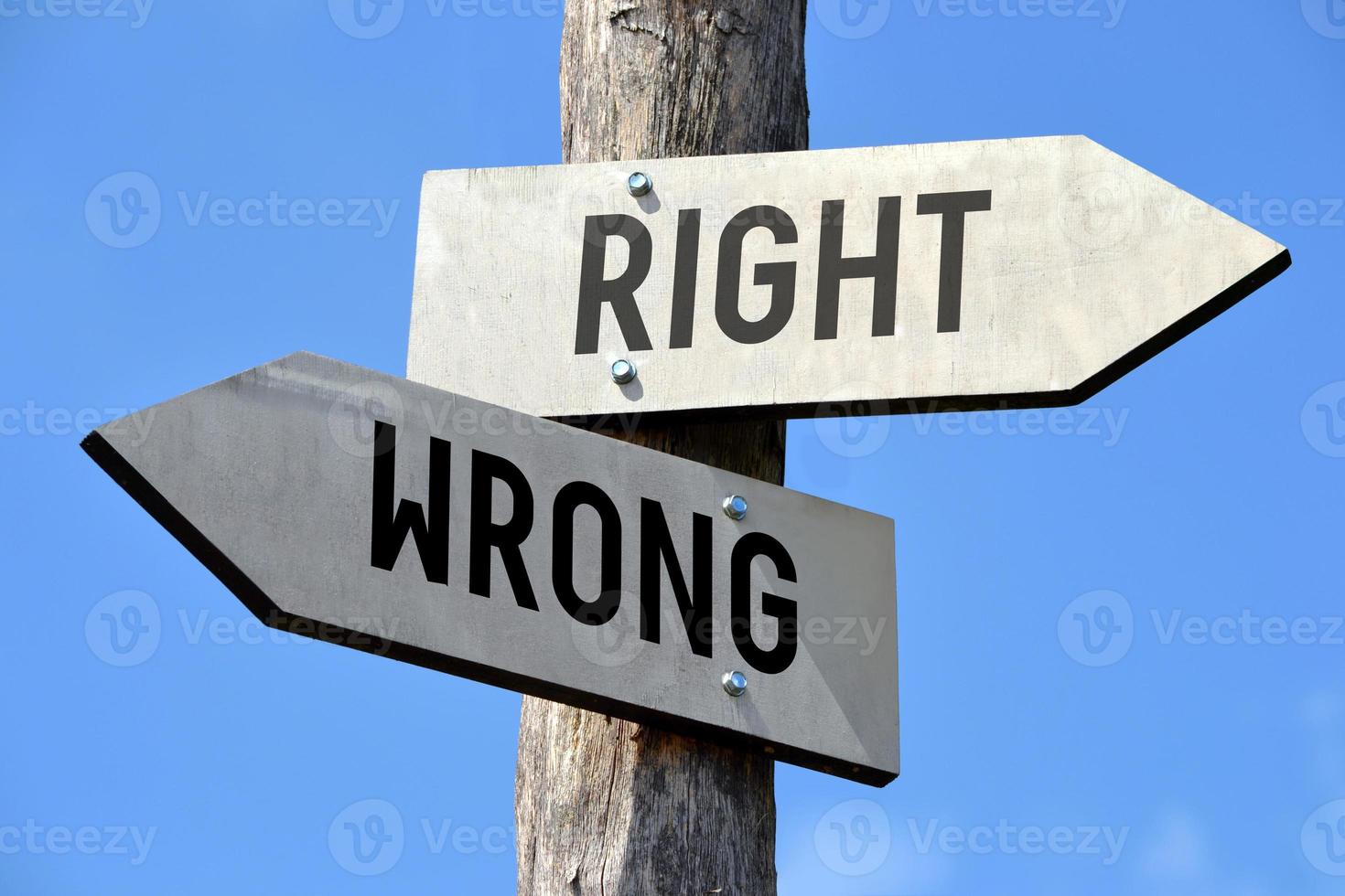 Right and Wrong - Wooden Signpost with Two Arrows photo