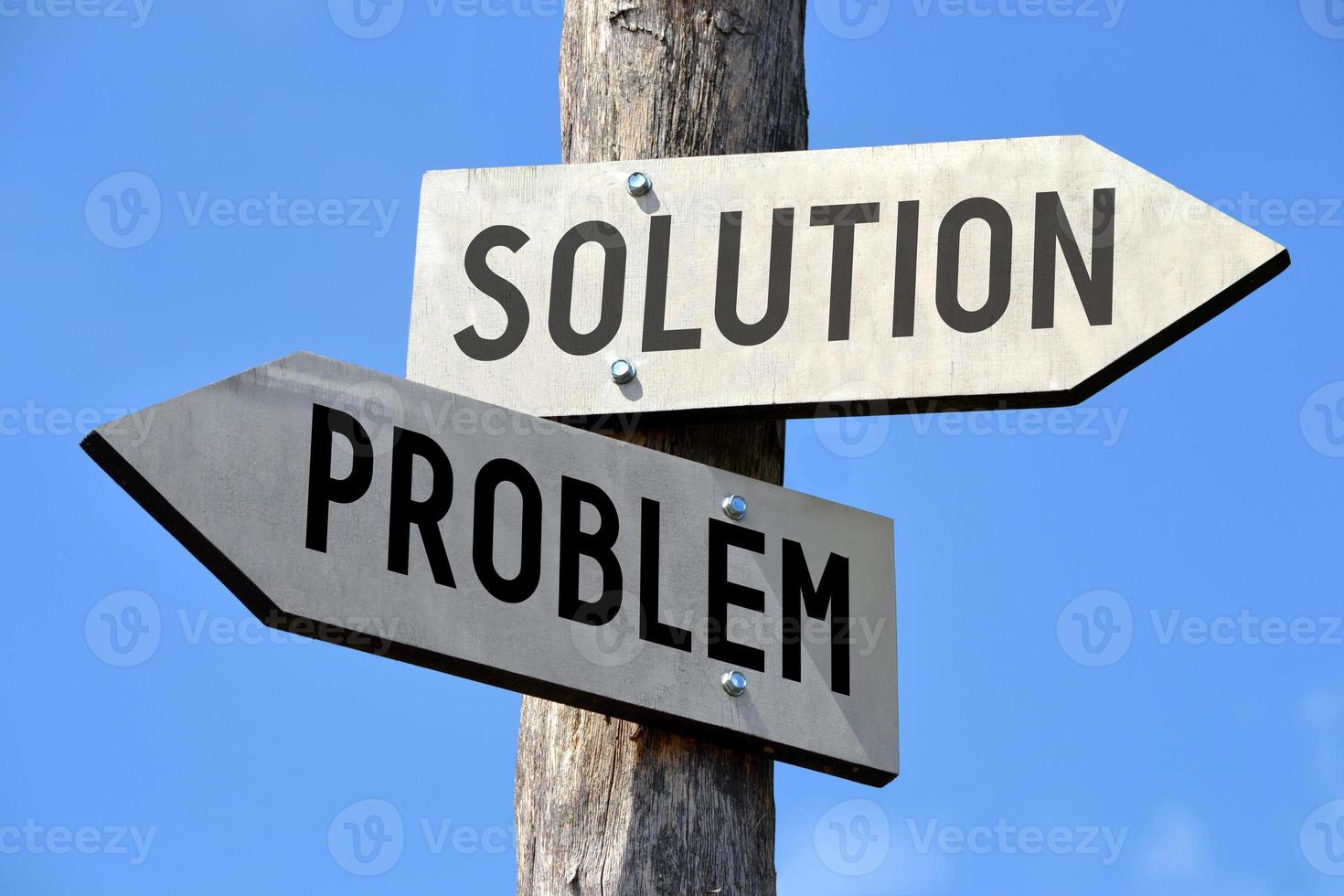 Problem and Solution - Wooden Signpost with Two Arrows photo