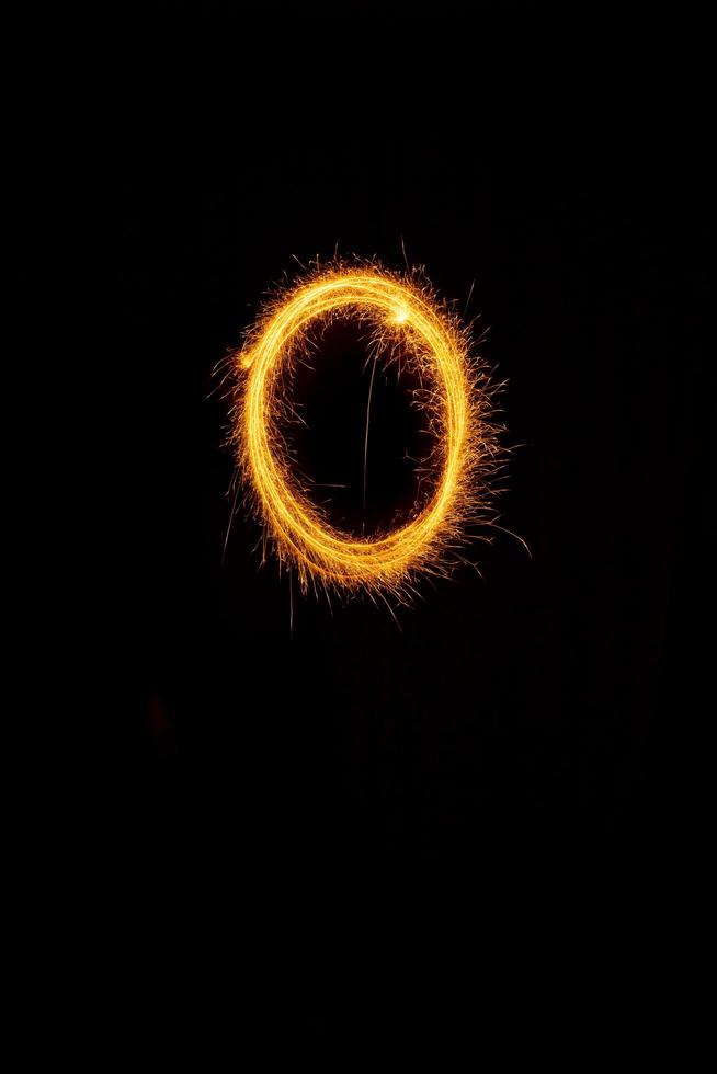 made with sAlphabet element made with sparklers ready for your inscriptions on black background photo