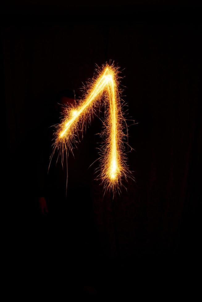 made with sAlphabet element made with sparklers ready for your inscriptions on black background photo