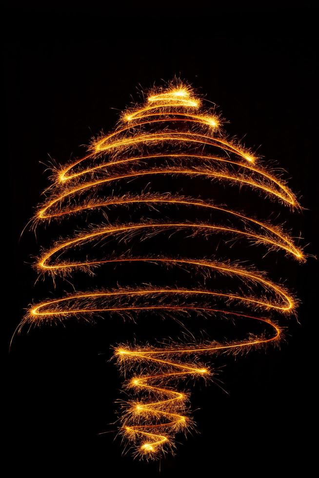 Tree made with sparklers ready for your inscriptions on black background photo