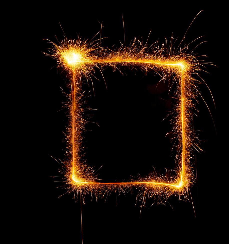 Square made with sparklers ready for your inscriptions on black background photo