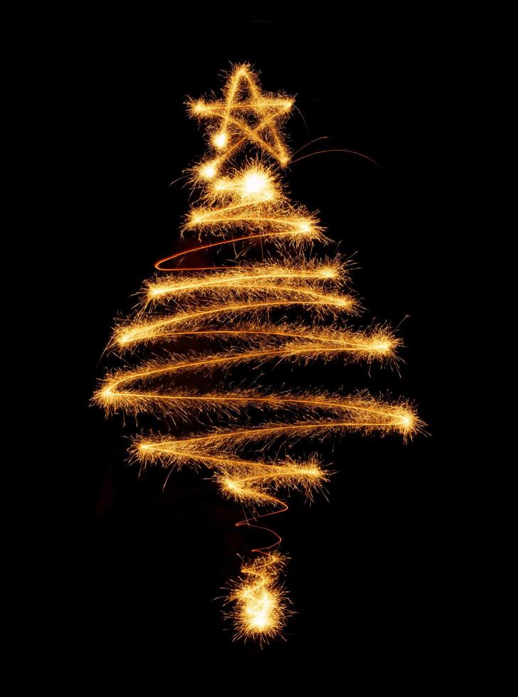 Tree made with sparklers ready for your inscriptions on black background photo