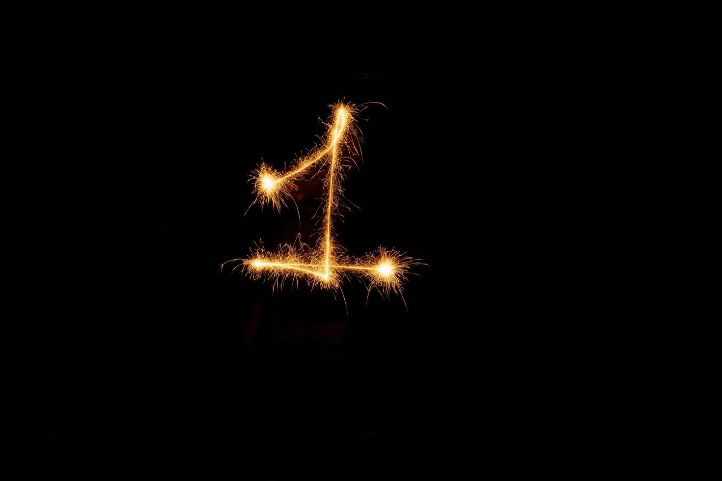 Number made with sparklers ready for your inscriptions on black background photo