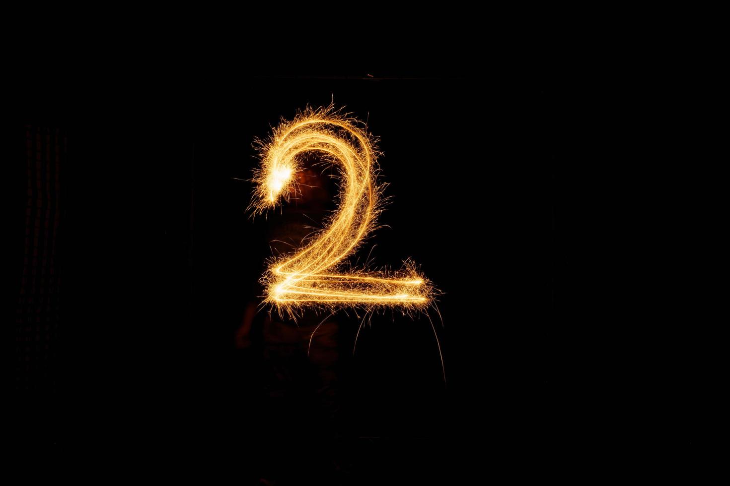 Number made with sparklers ready for your inscriptions on black background photo