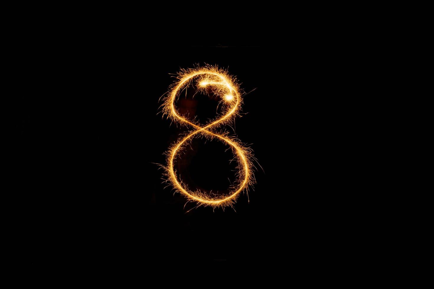 Number made with sparklers ready for your inscriptions on black background photo