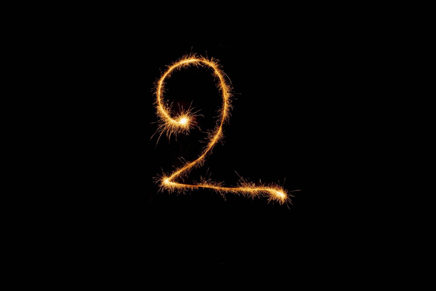 Number made with sparklers ready for your inscriptions on black background photo