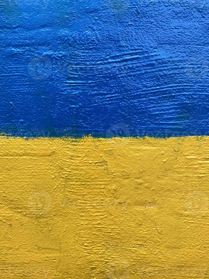 Ukrainian national flag painted on wall photo