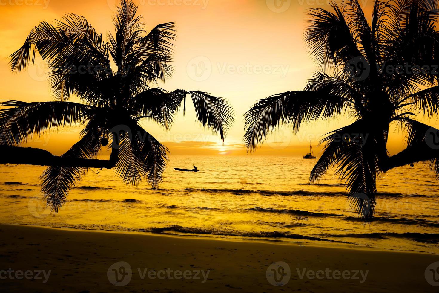 Beautiful sunset on the tropical sea beach.Silhouette of palm trees on pink sky background for travel and vacation as summer photo